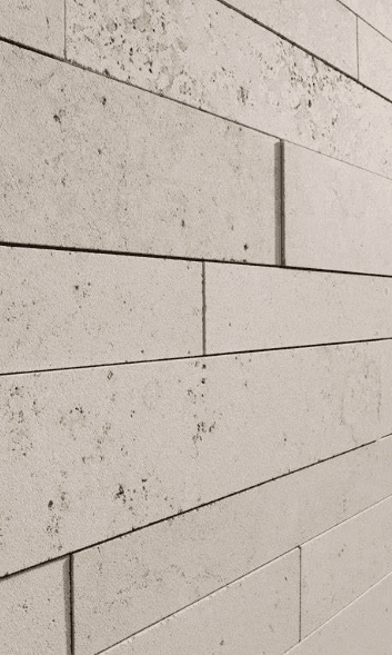 Travertine wall tiles with subtle natural imperfections, emphasizing the stone's raw and organic texture for a modern facade. 