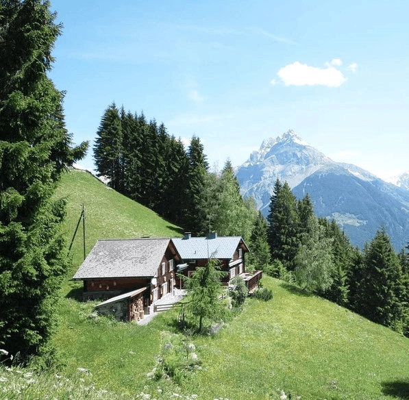 a group of people doing yoga in a room