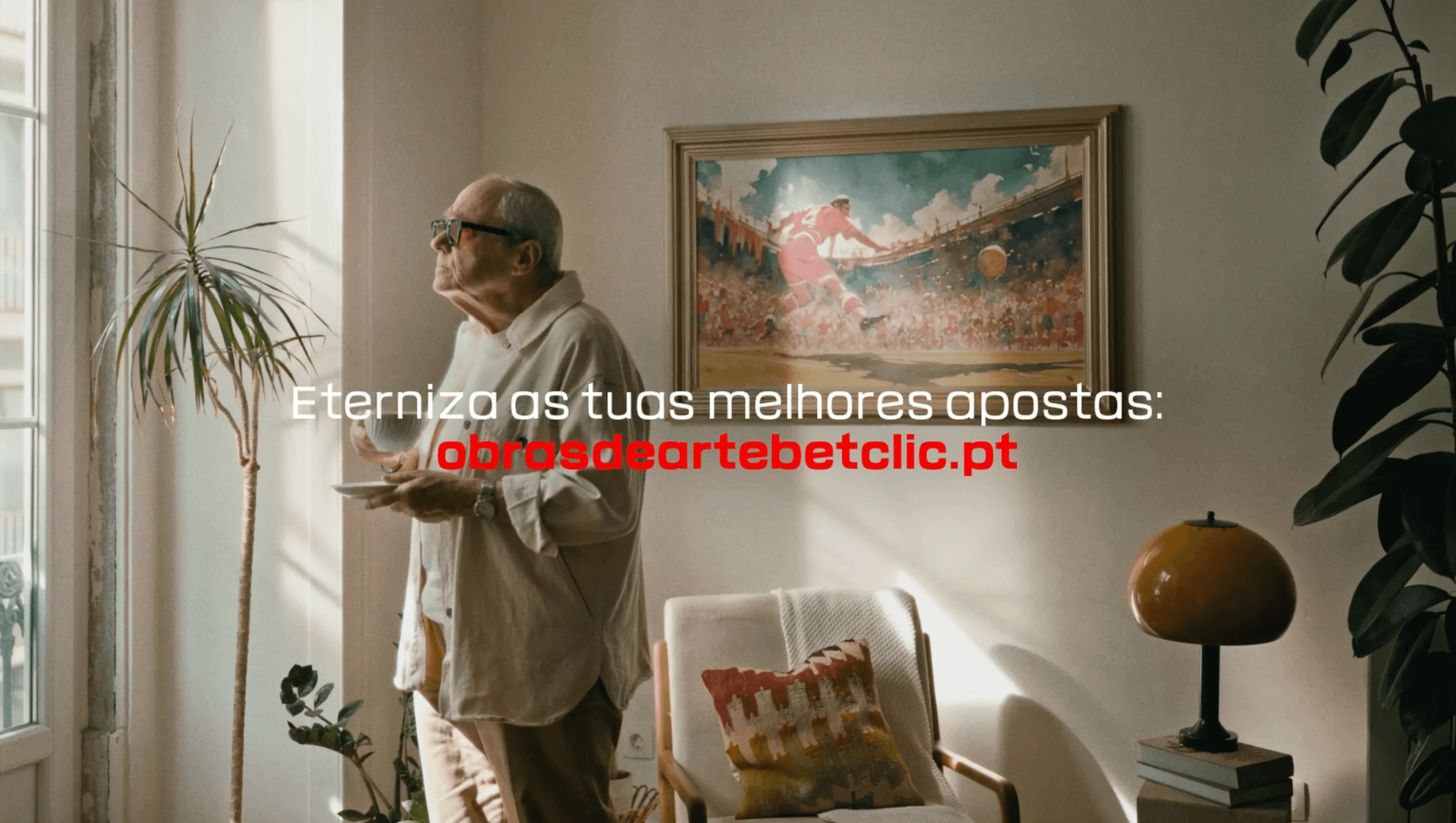 Iconic Portuguese sports commentator Gabriel Alves looking at a painting on a wall during the Betclic Works of Art commercial campaign produced by Mosaic Media House.