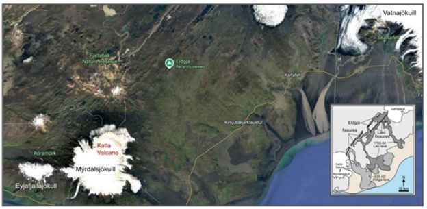 The picture shows the Eldgjá canyon in Katla Geopark, in the Highlands of south Iceland from the air. The Eldgjá volcanic fissure eruption that formed this canyon was the largest on earth in the past 1000 years, and the canyon itself stretches 40 kilometers in length. There is a long, lush green canyon, and black and red lava beds and sands. A waterfall pours down the side of the mossy canyon.