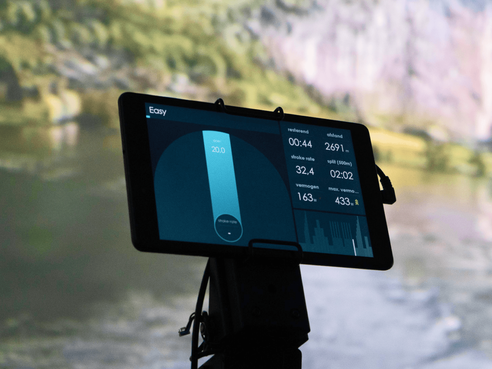 tablet mounted on a rowing machine displaying the individual performance data of the athelte.