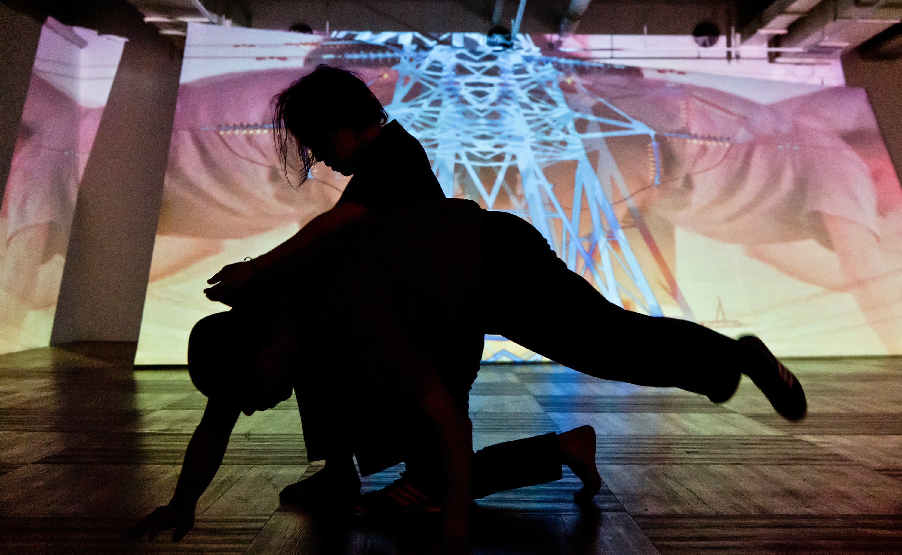 Sunlight casting shadows through orange blinds