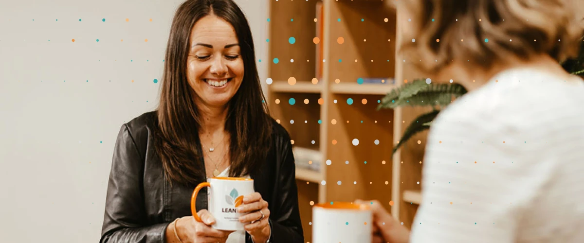 Lean Tree consultants holding mugs having a meeting