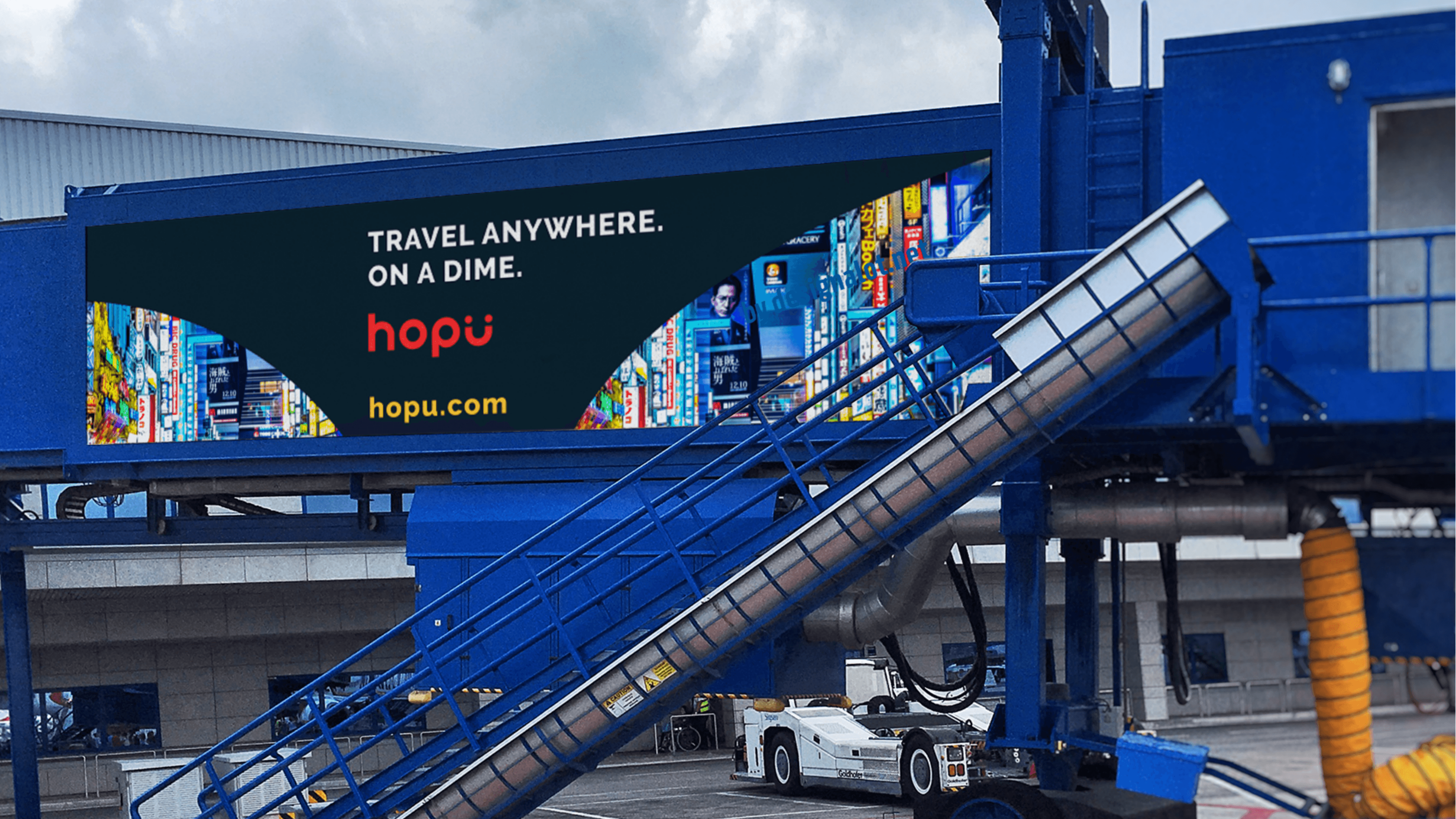 Airport billboard: travel anywhere, on a dime.