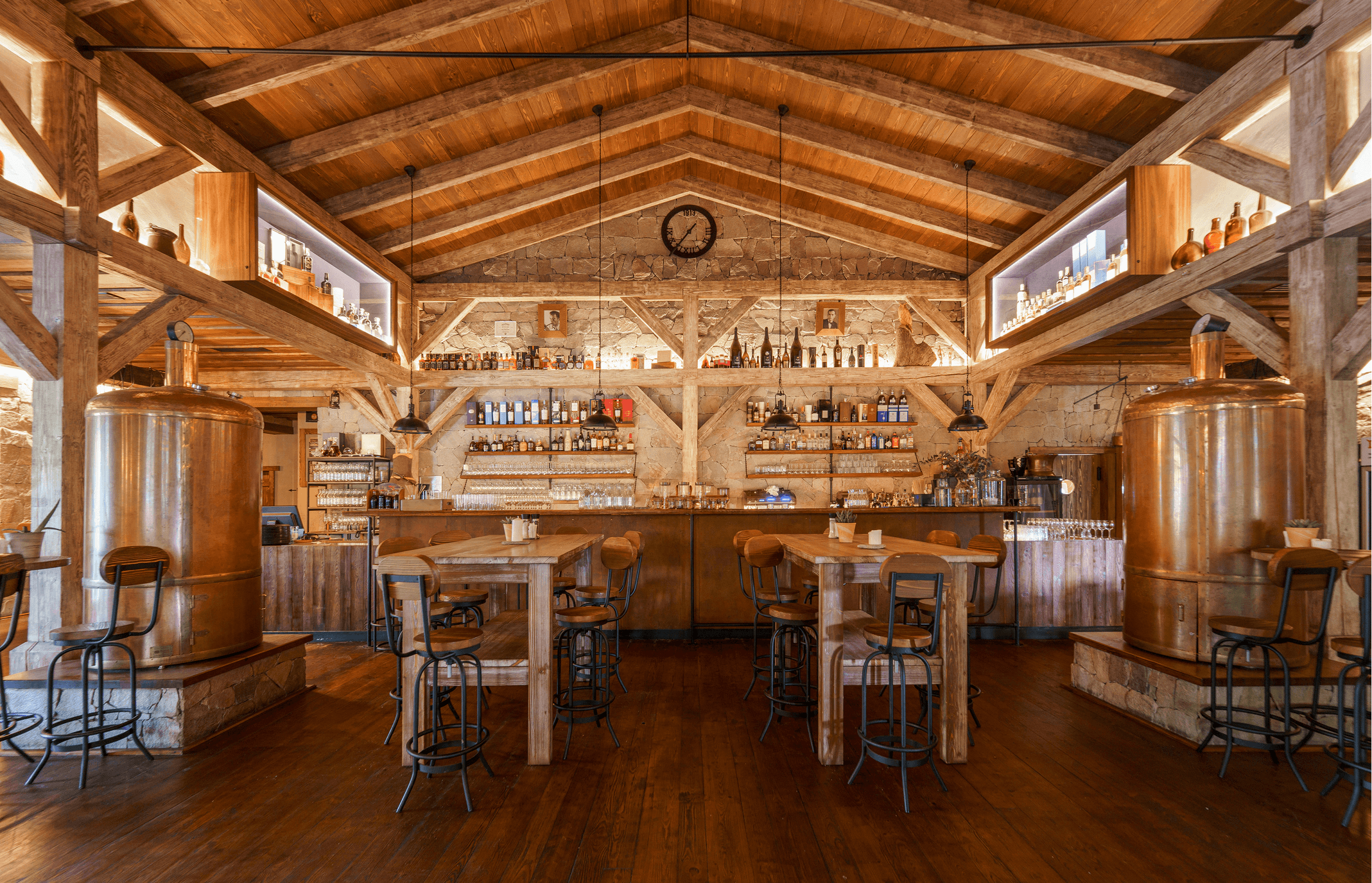 Rustic bar interior with wooden furniture and warm ambiance.