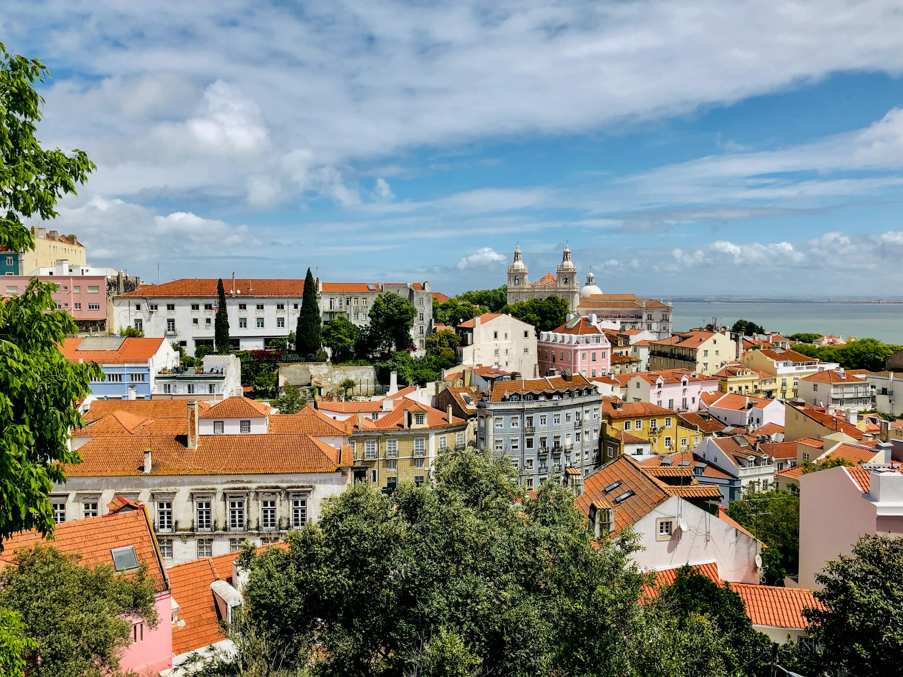 View over Lisbon terracotta rooftops towards the river