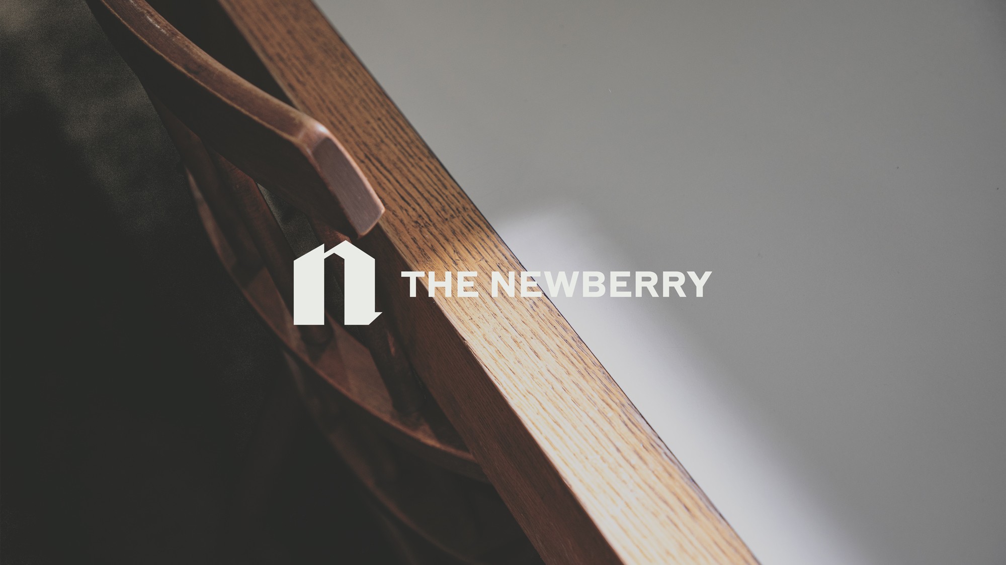 Newberry thumbnail of logo on desk backdrop