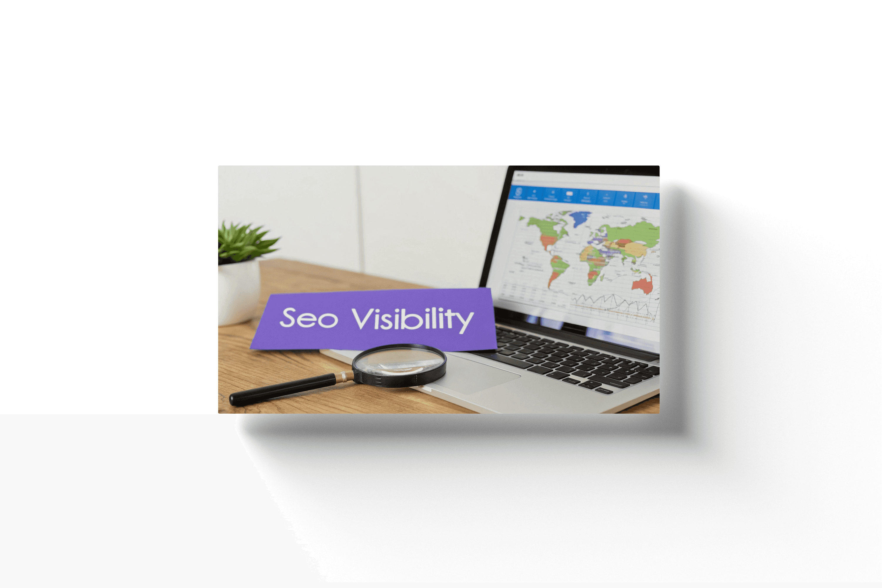 a laptop displayin ga map with a magnifying glass laying on the keyboard next to a purple card displaying 'seo visibility'