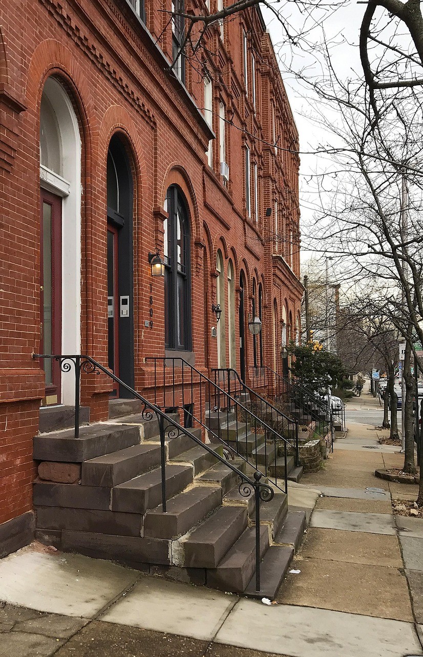 Brick row houses in Baltimore with arched entry ways