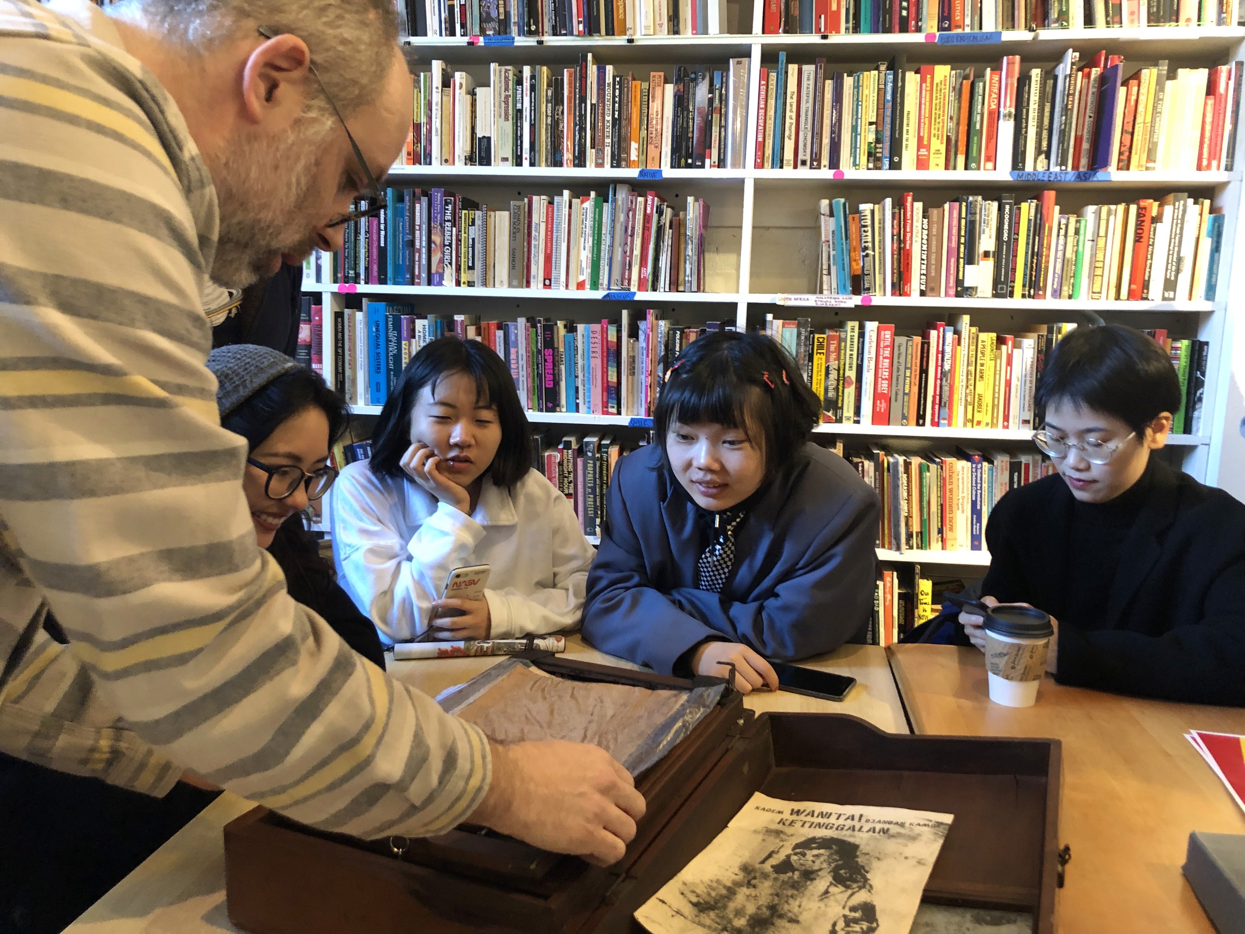 Josh MacPhhee at the library with students