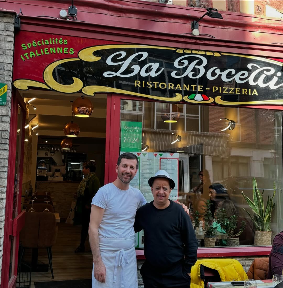 Abstract blurred motion of people working in a colorful office.