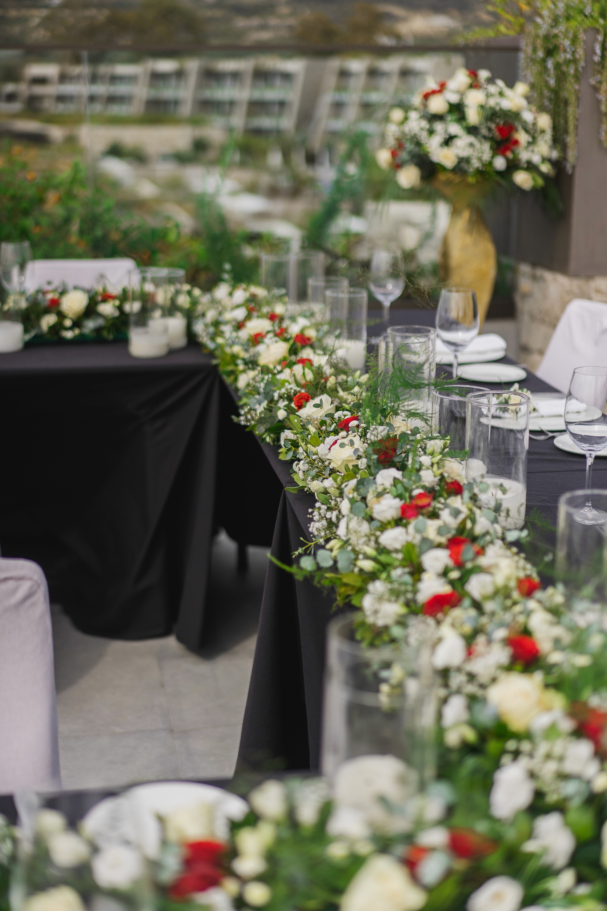 Bespoke wedding guest book table setup with floral details and custom cookies in Greece