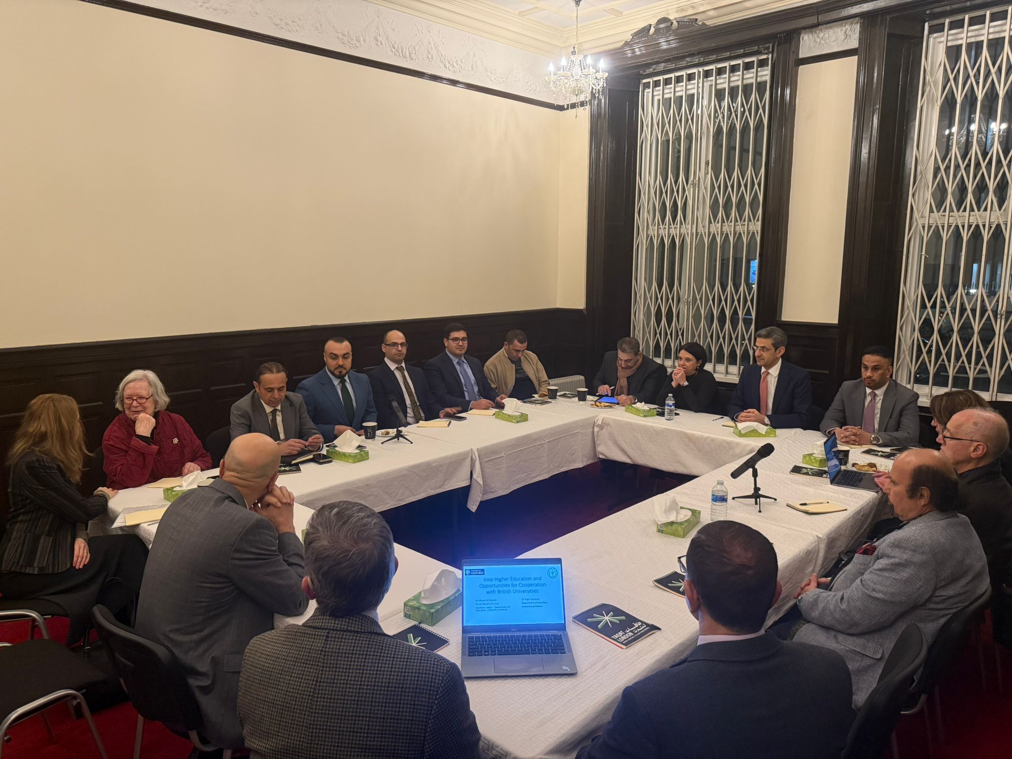 Participants in an Iraq–UK policy discussion.