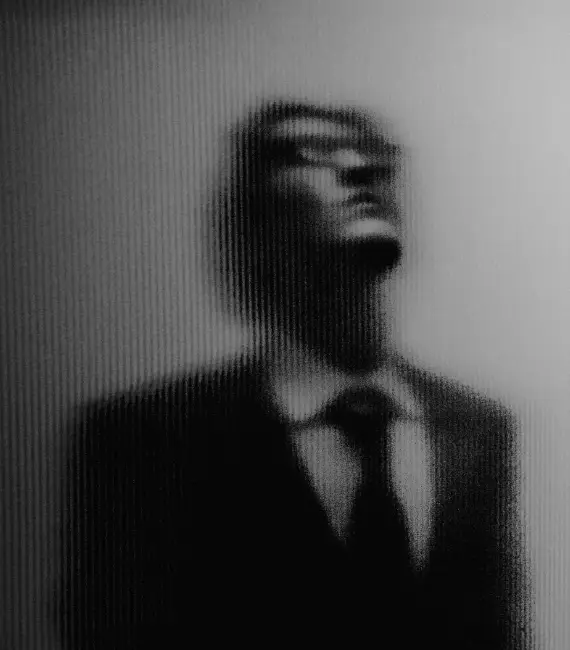 character in outline production posing behind glass