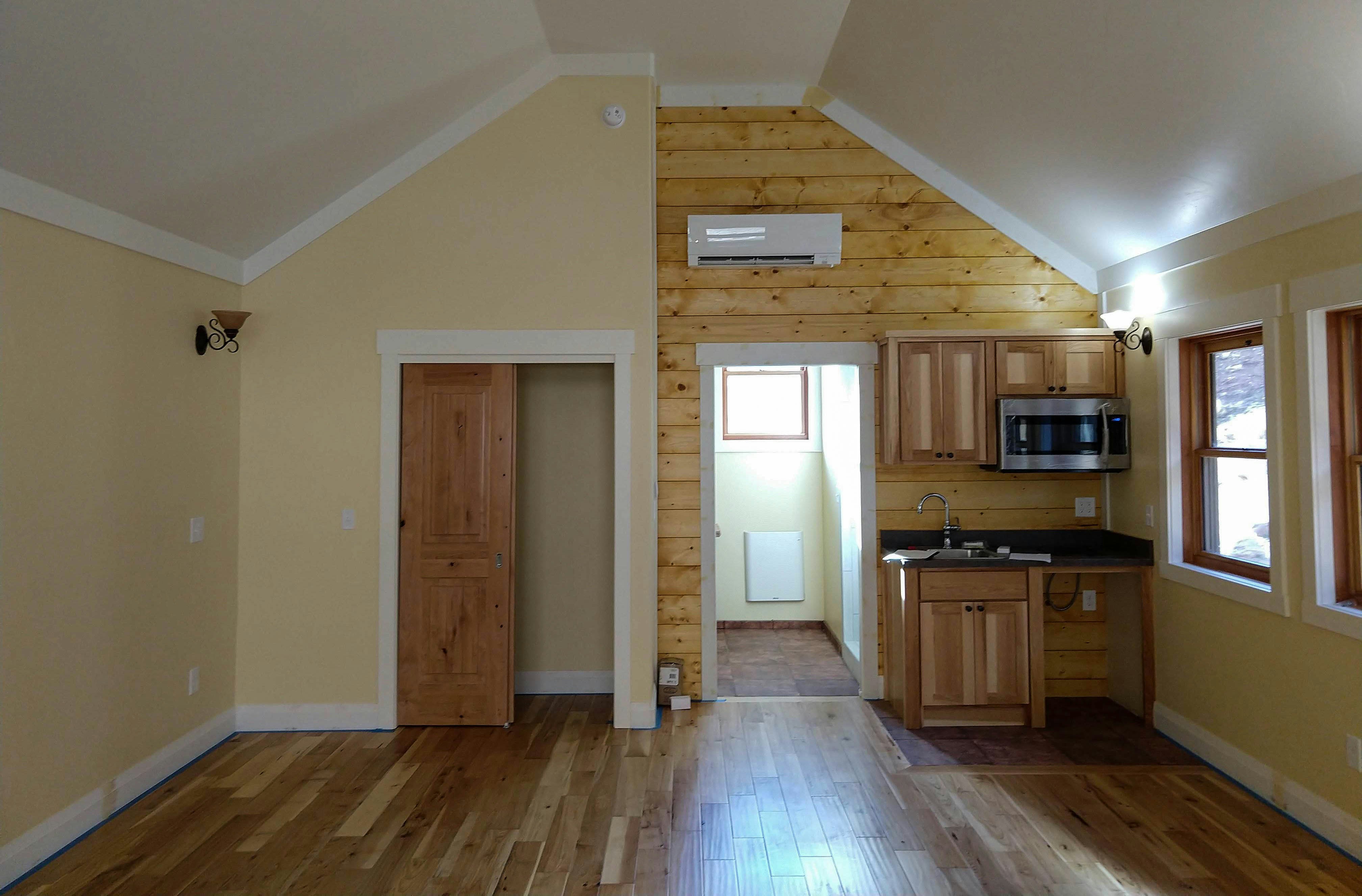 a kitchen with wooden floors