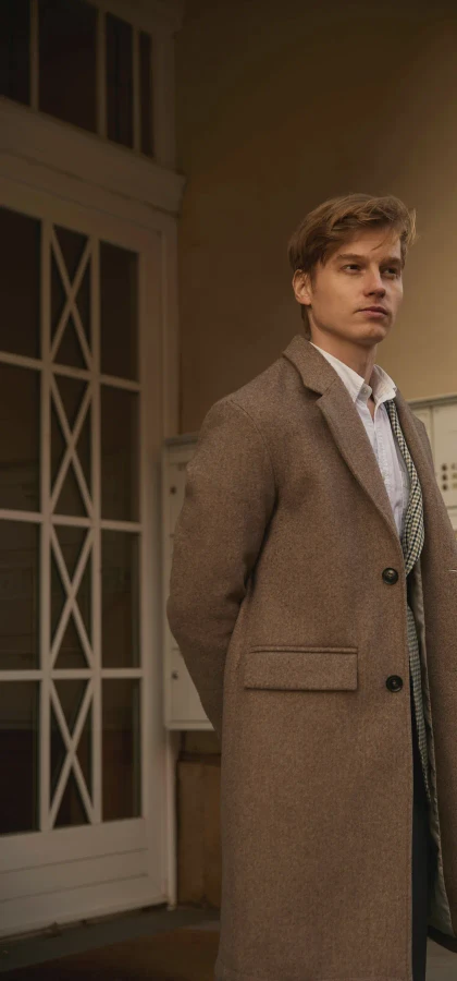 Brown overcoat in a doorway