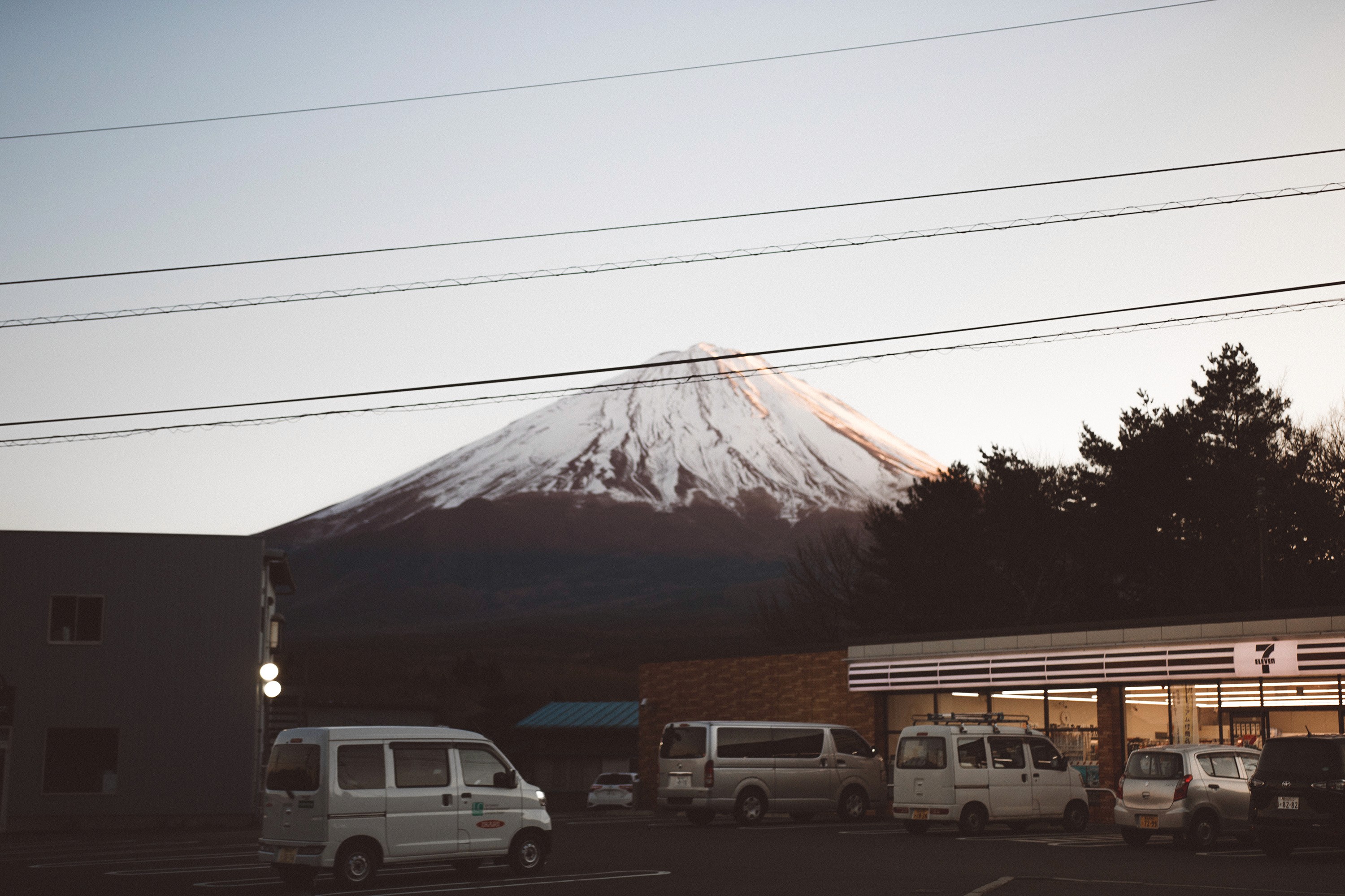 Mount Fuji Hakone Japan in the background with 7/11 convenience store in foreground