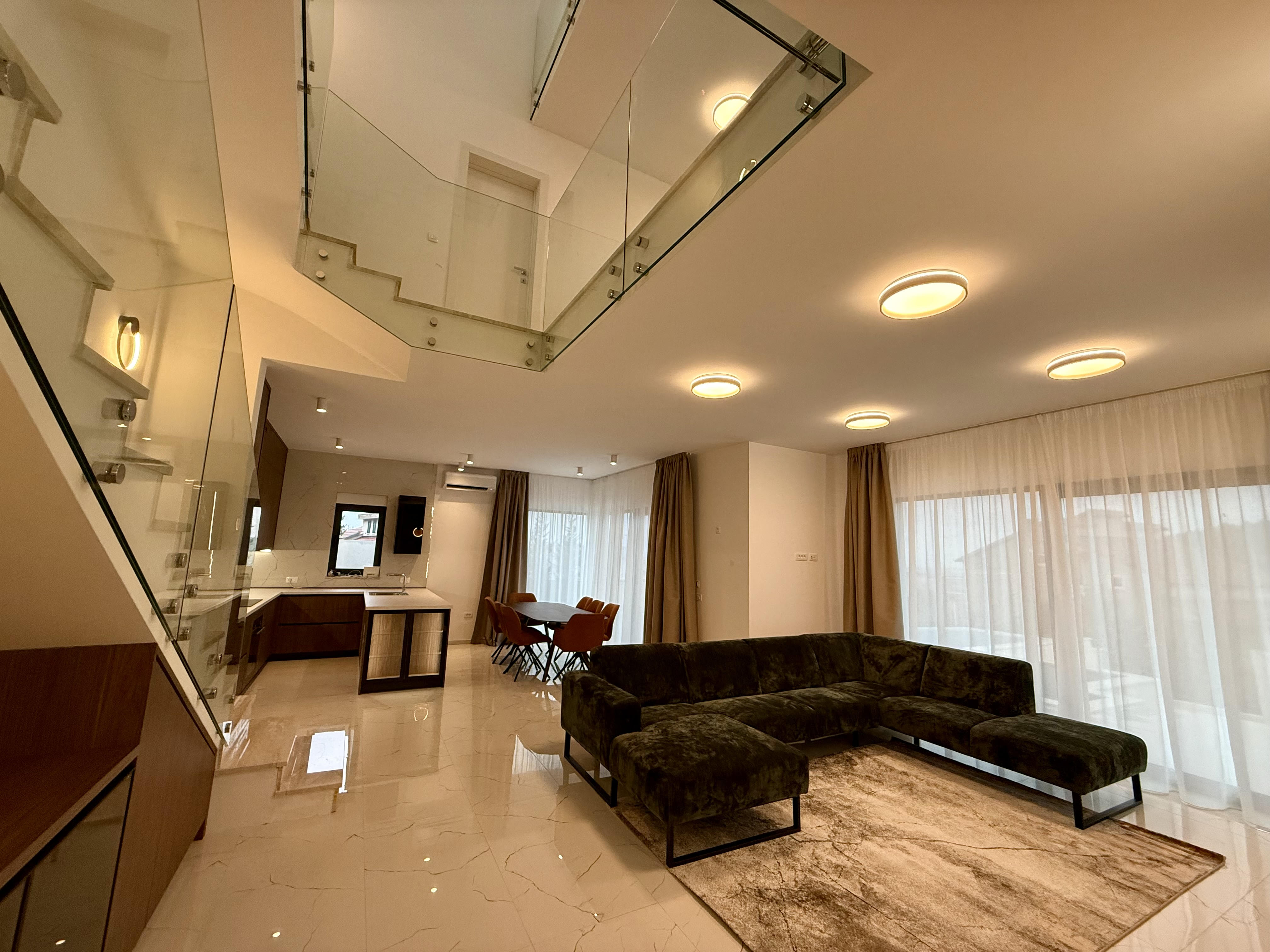 Industrial bathroom with concrete walls and wooden vanity with plants.