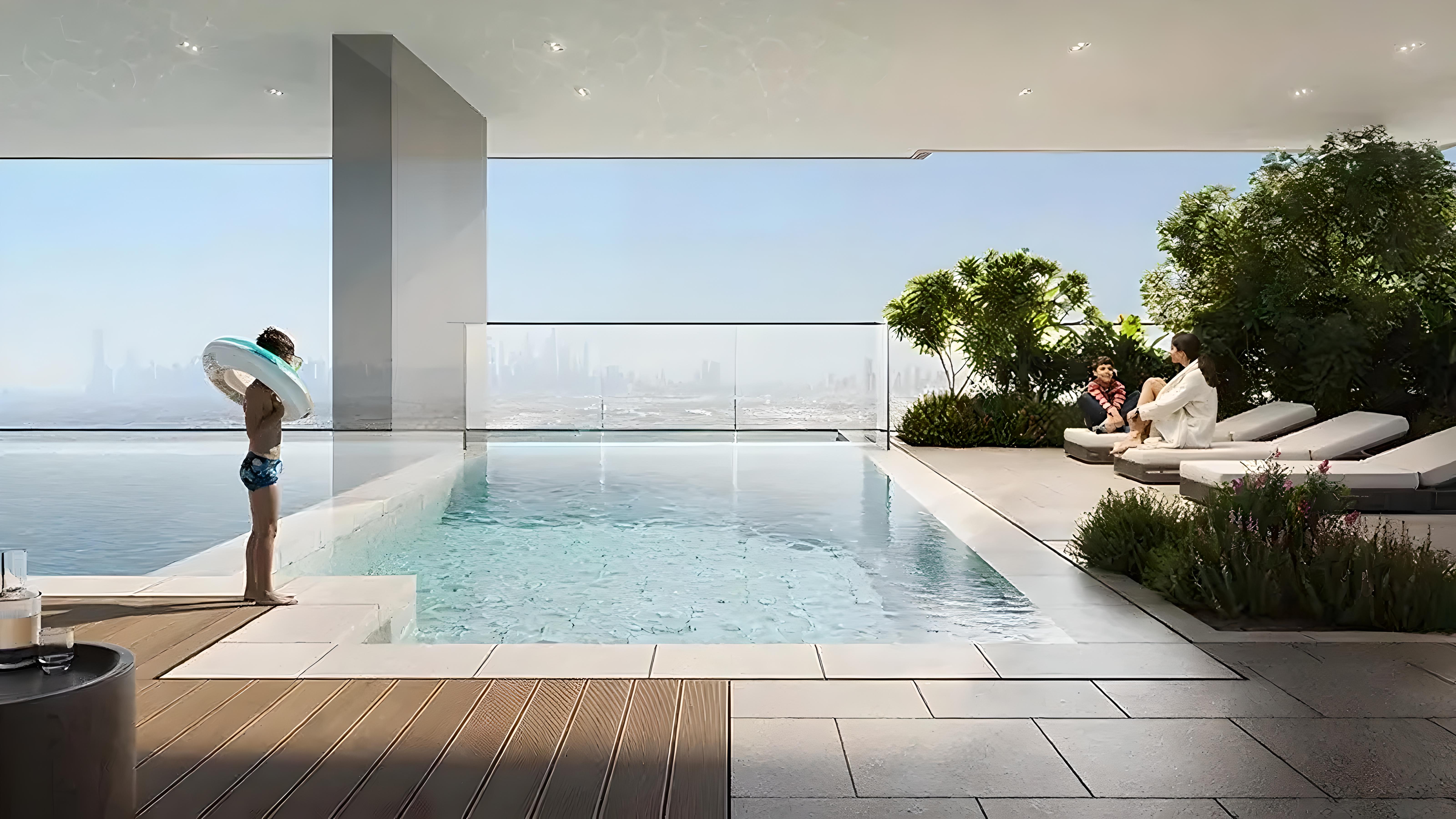 A rendering of a pool at Elaris Rise, overlooking a vibrant city skyline in the background.
