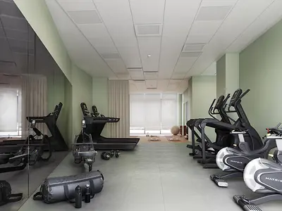 On-site student gym with treadmills, cross-trainers and free weights at Florentia Living, Florence