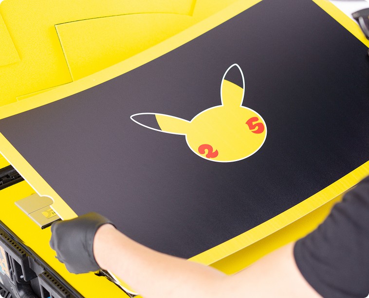 A cover poster with a stylized image of pikachu being laid into the influencer kit