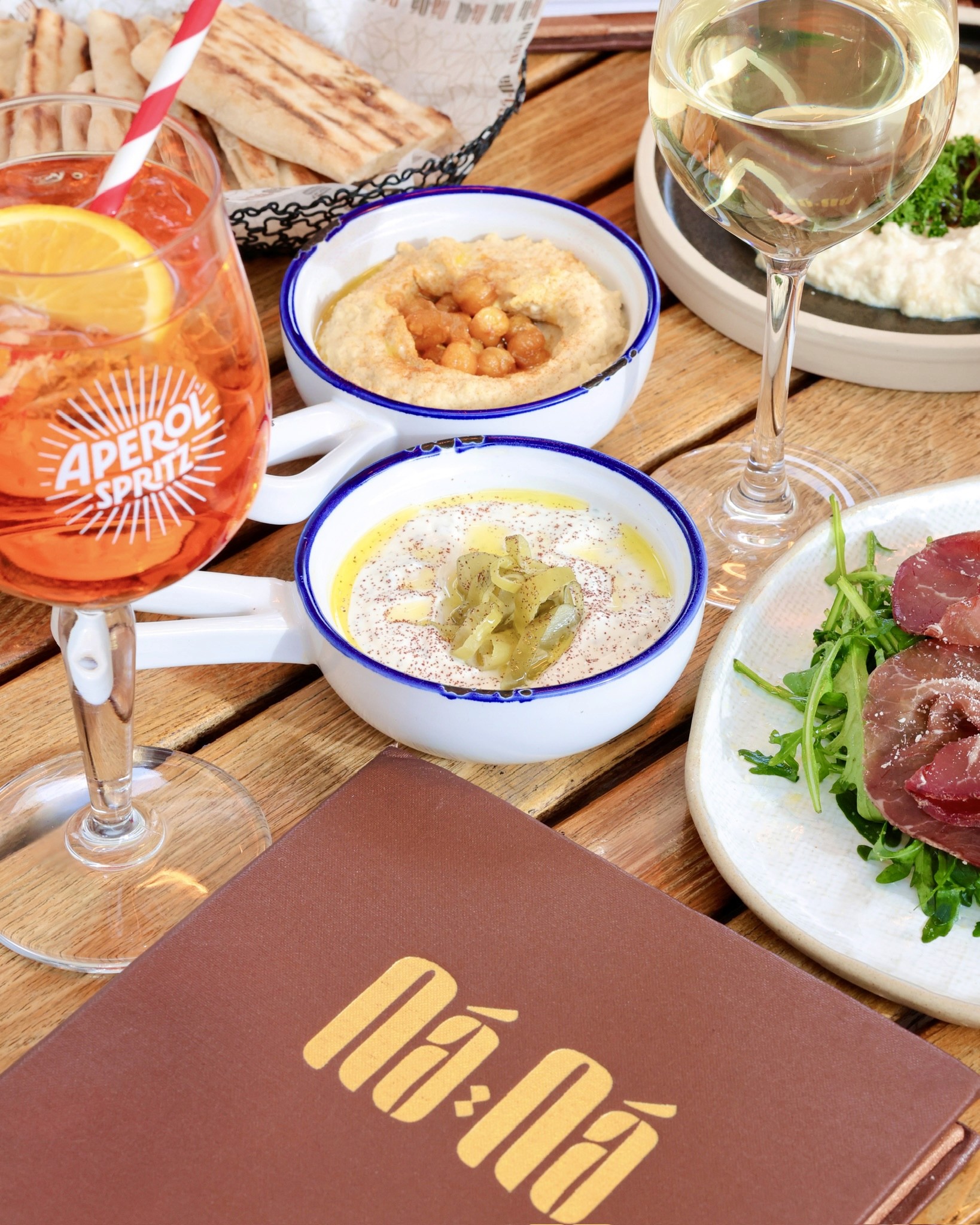 NANA Cafe lit at night in Covent Garden