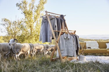 brown and white concrete house near green trees during daytime