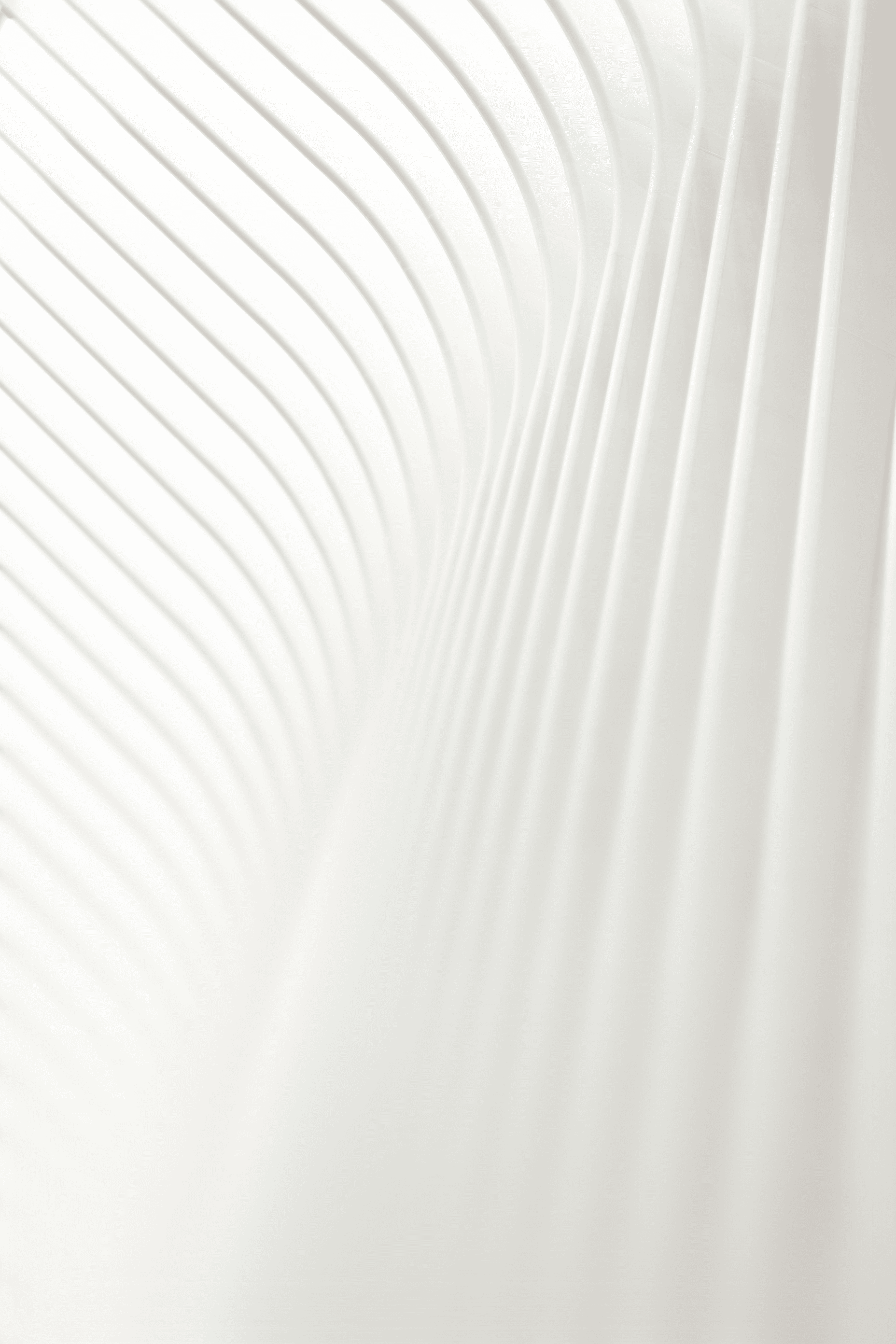 a man riding a skateboard on top of a white wall