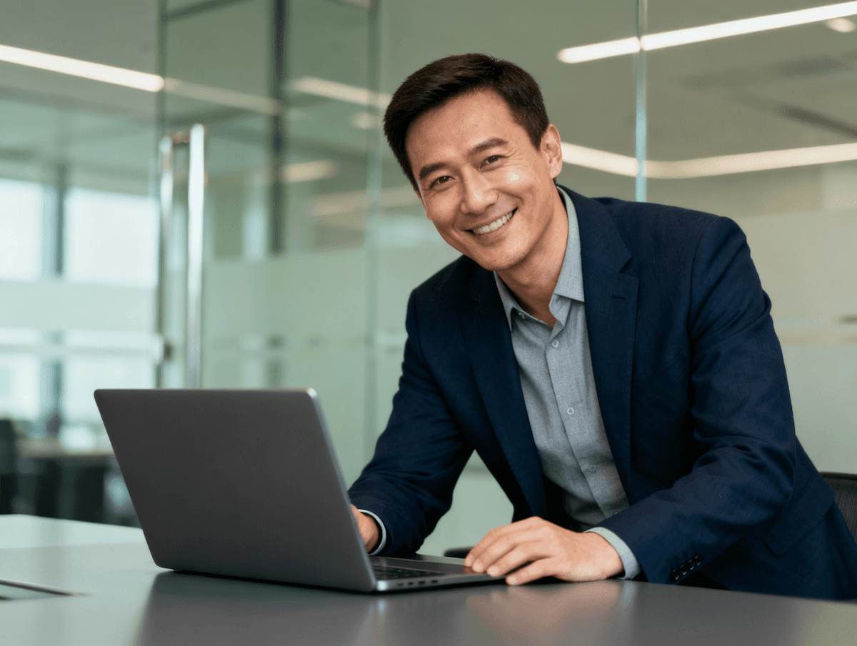 AI automation platform showcasing a professional working on a laptop in a modern office environment in a clean UI.