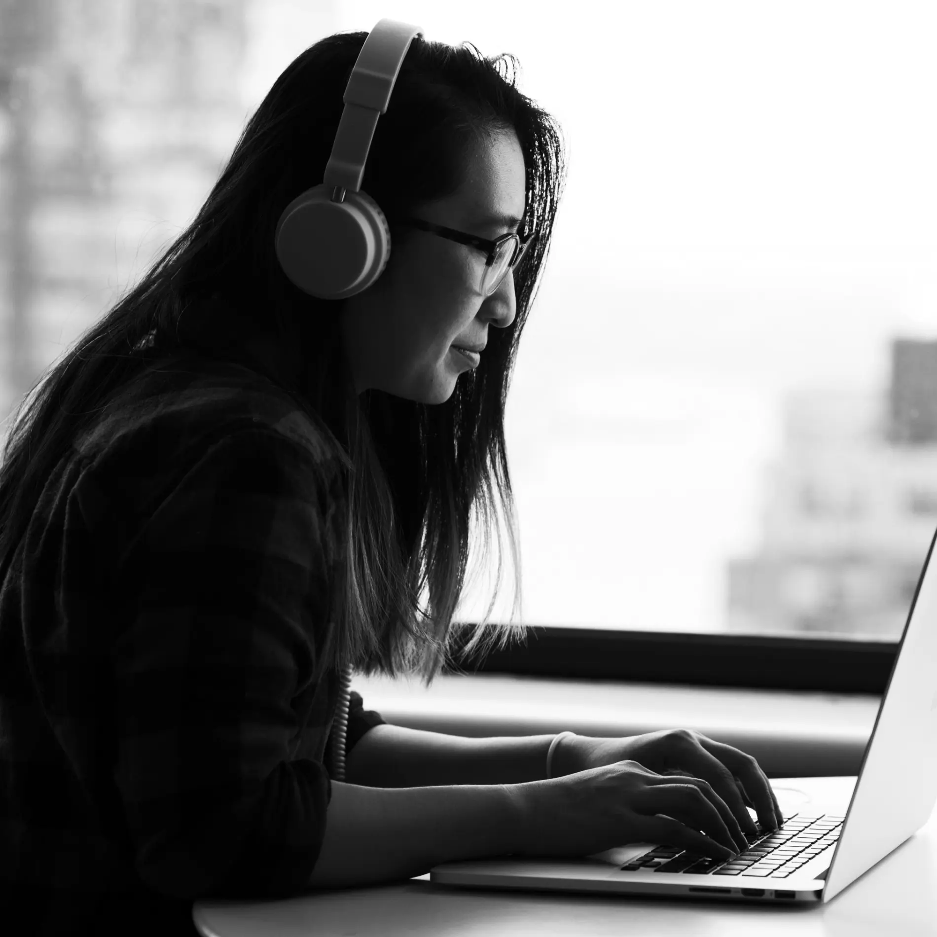 Music artist working on a laptop.