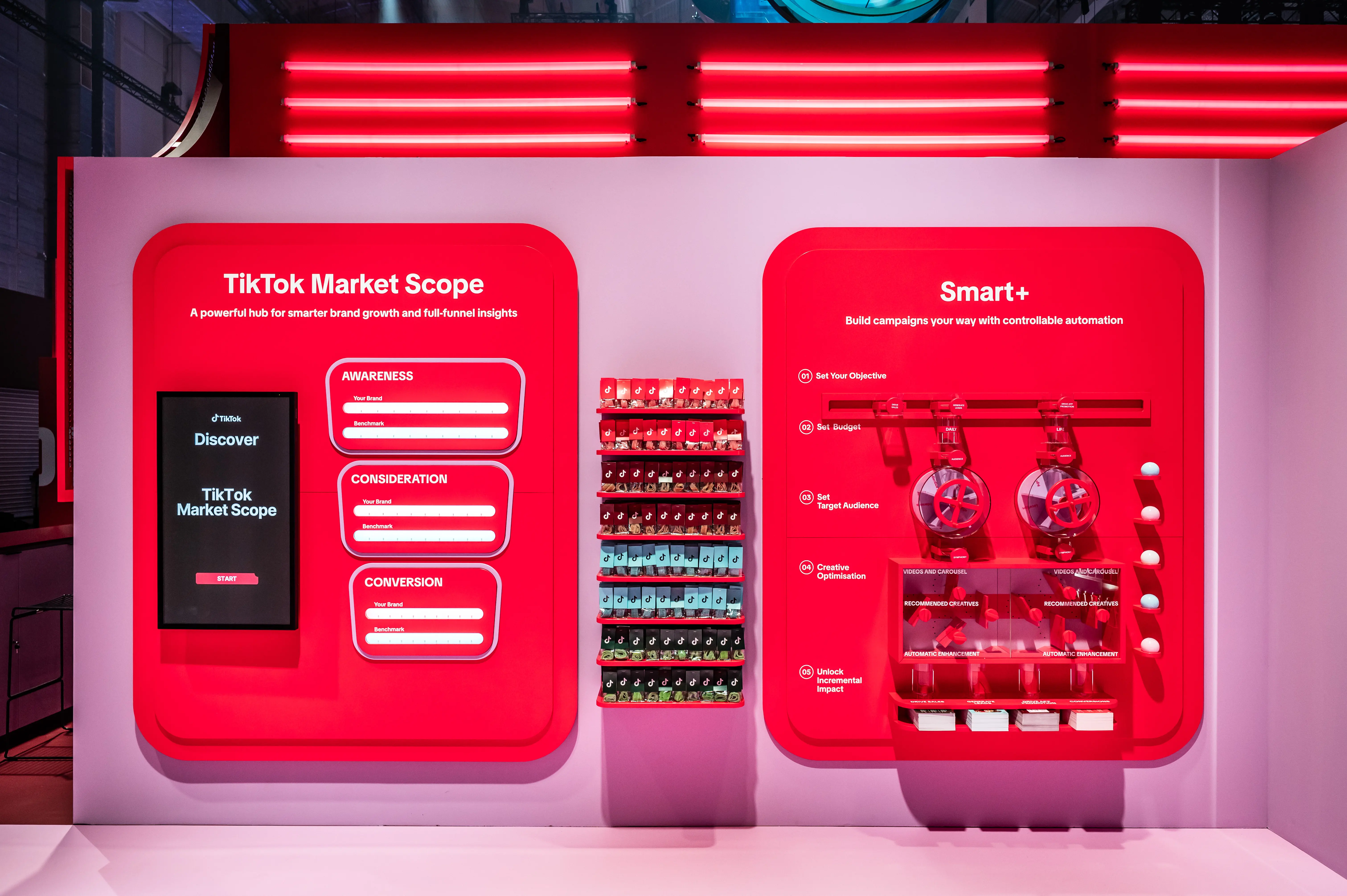 Red info wall with TikTok Market Scope screen, product gumball dispensers and Smart+ display.
