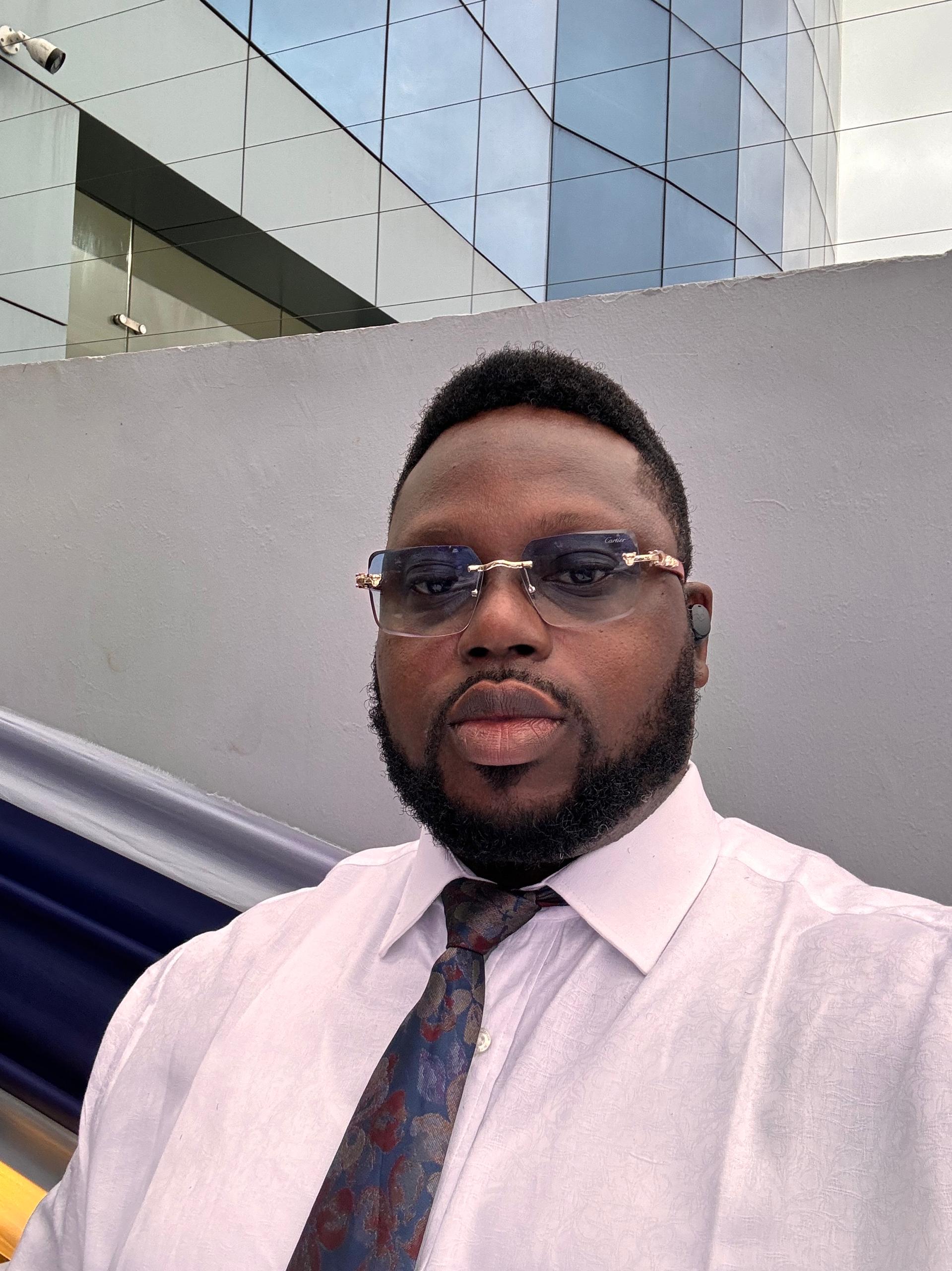 a picture of a lady seated in her office