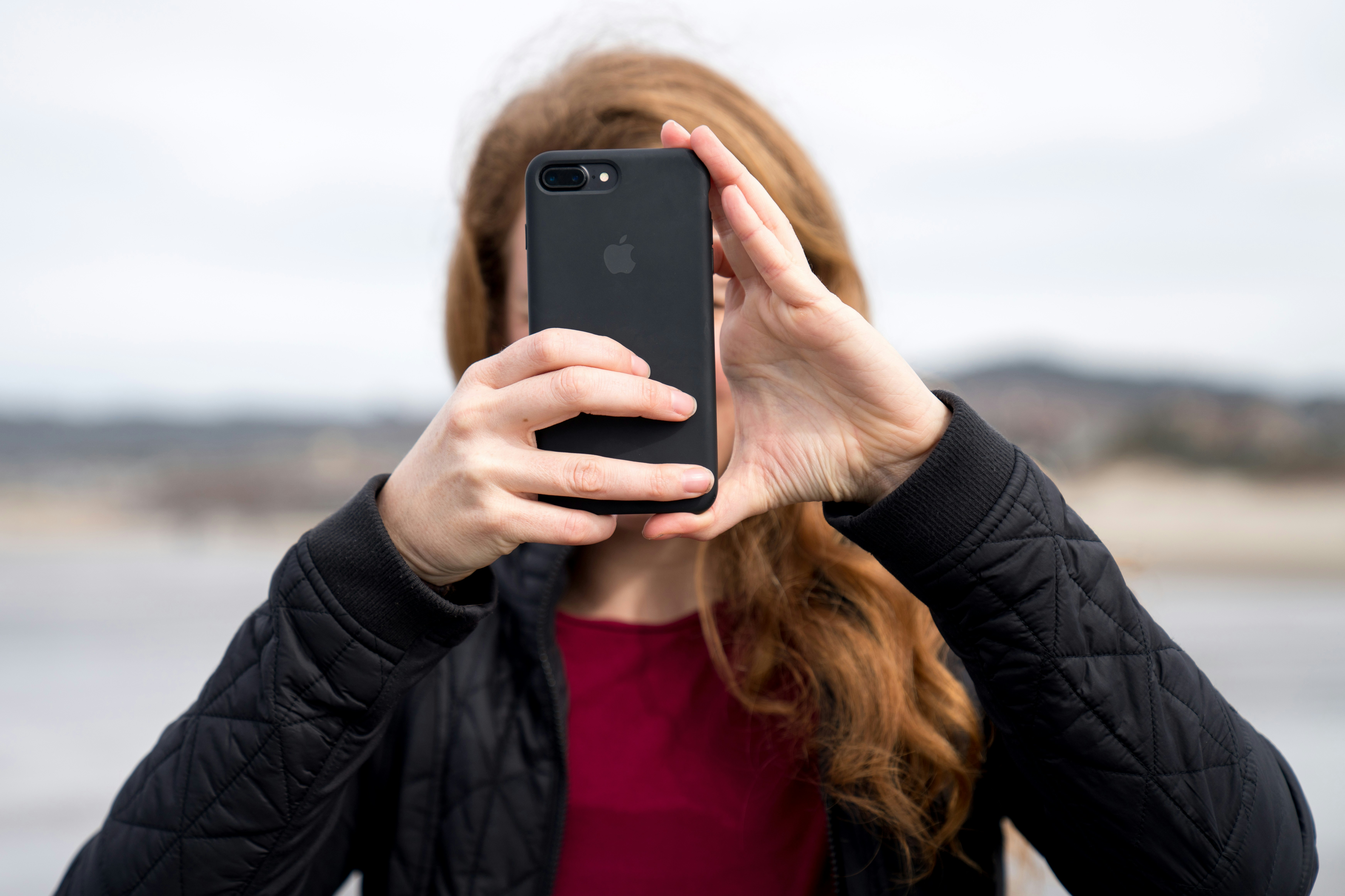 Girl Filming on Phone -  InVideo Alternatives