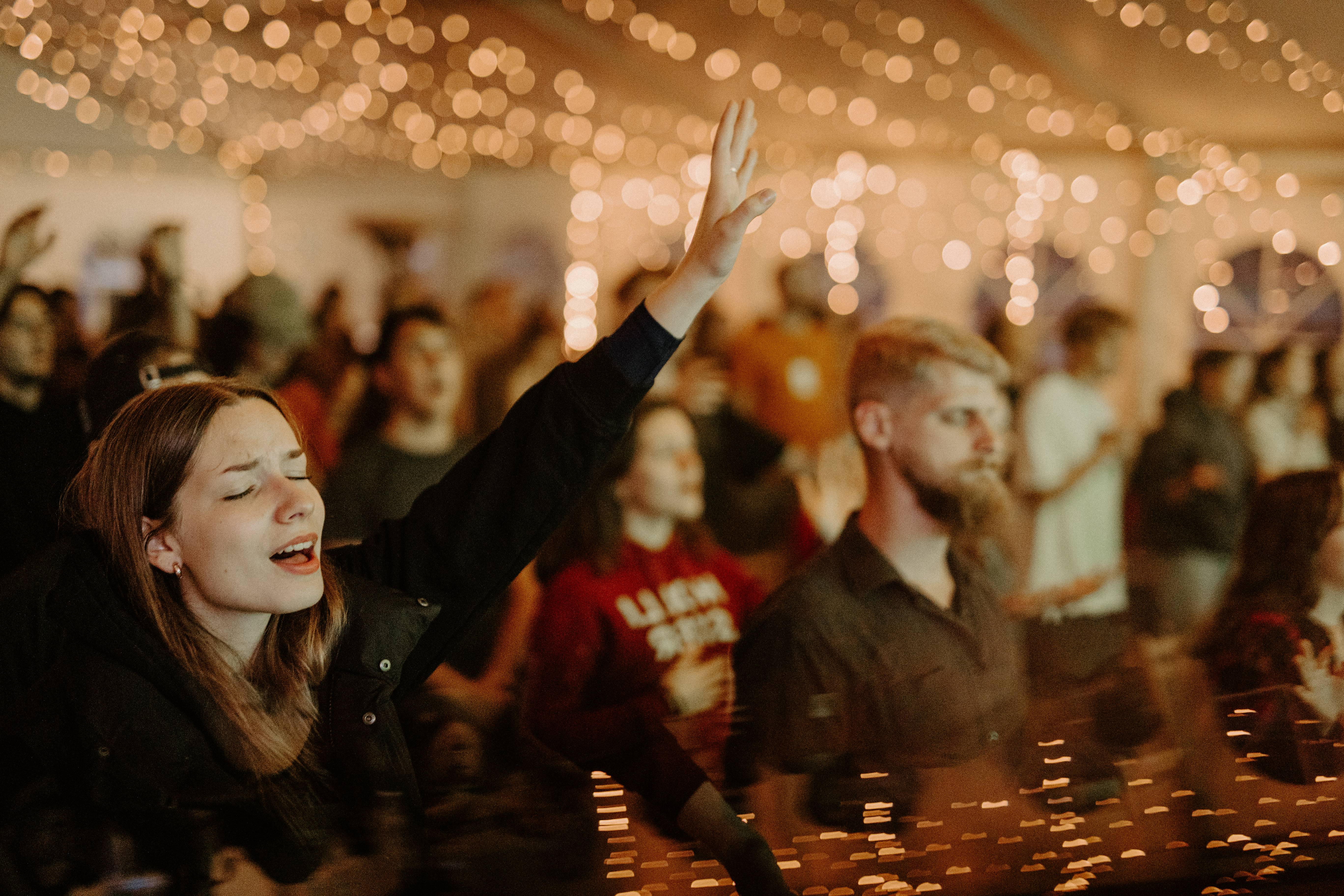 Large group posing under bridge in retro fashion