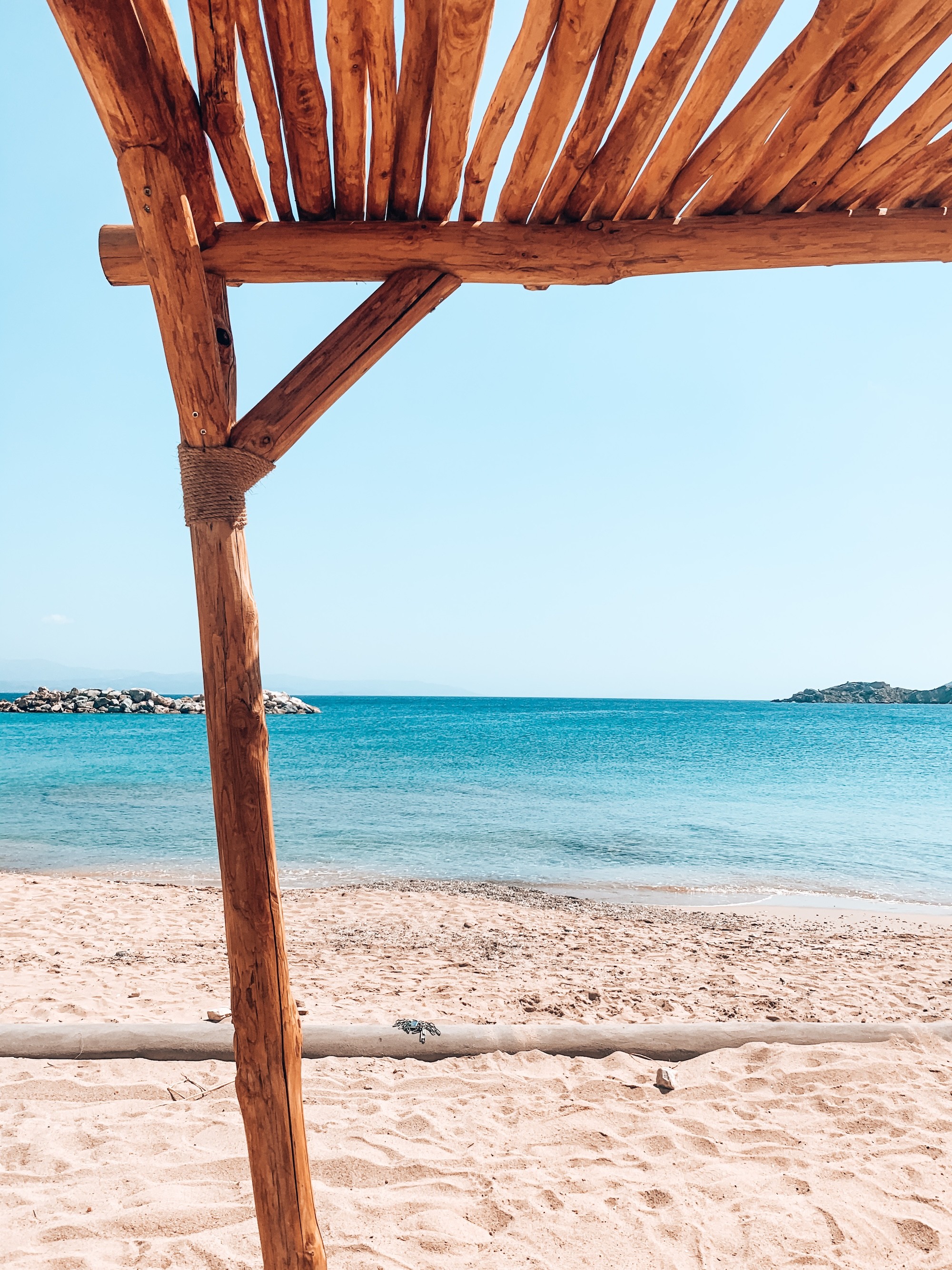 Sandy beach and turquoise waters.