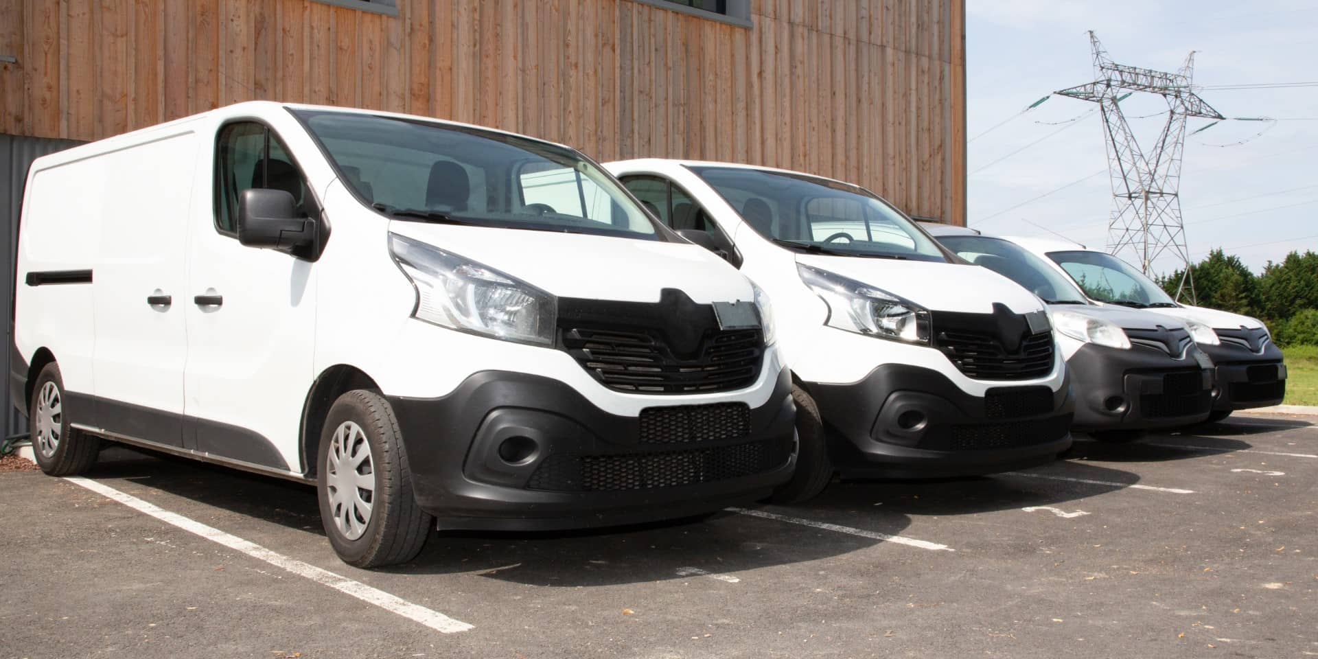 Image of a group of swb vans lined up next to each other outside