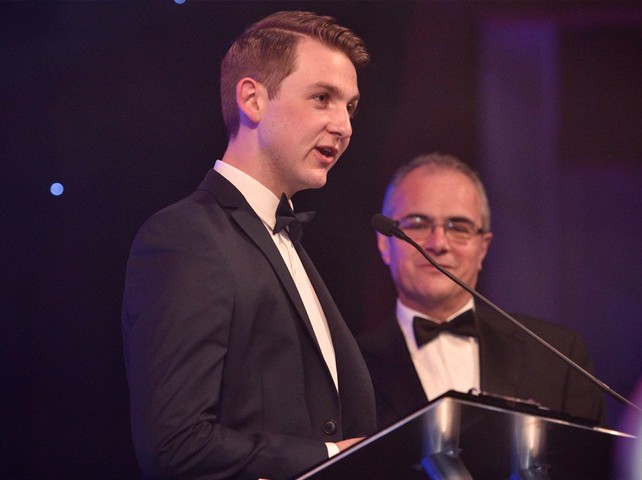 Photo of Andrew giving a speech at an event