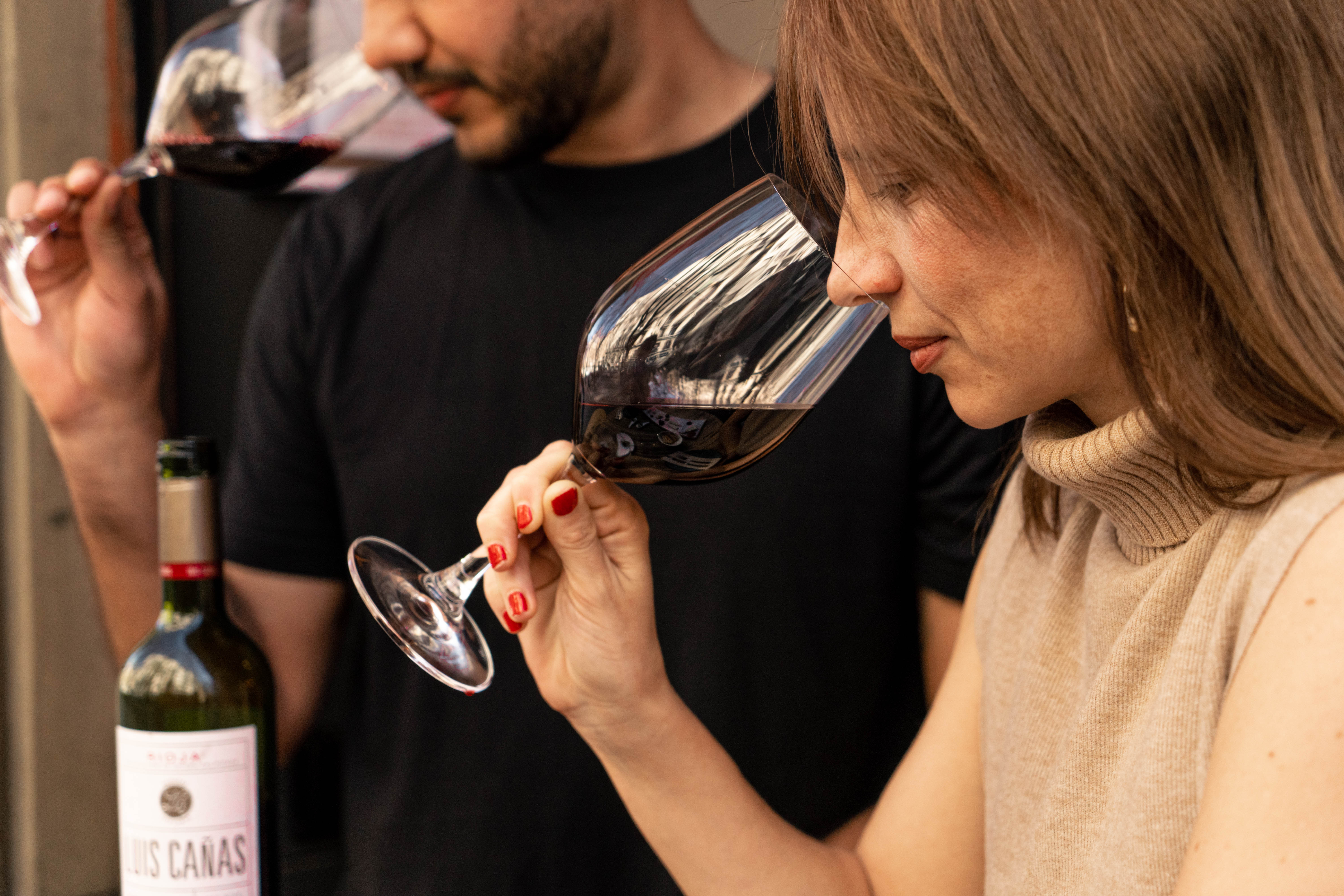 Sommelier guiding guests through a wine tasting experience in Barcelona.