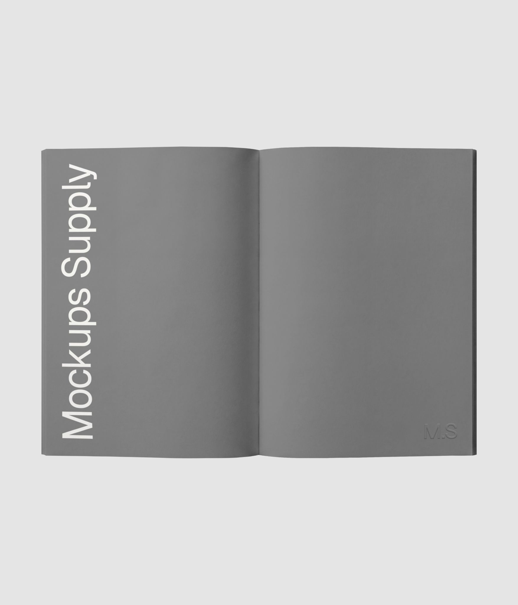 Open spread paperback book mockup with editable editorial layout download on Mockups Supply