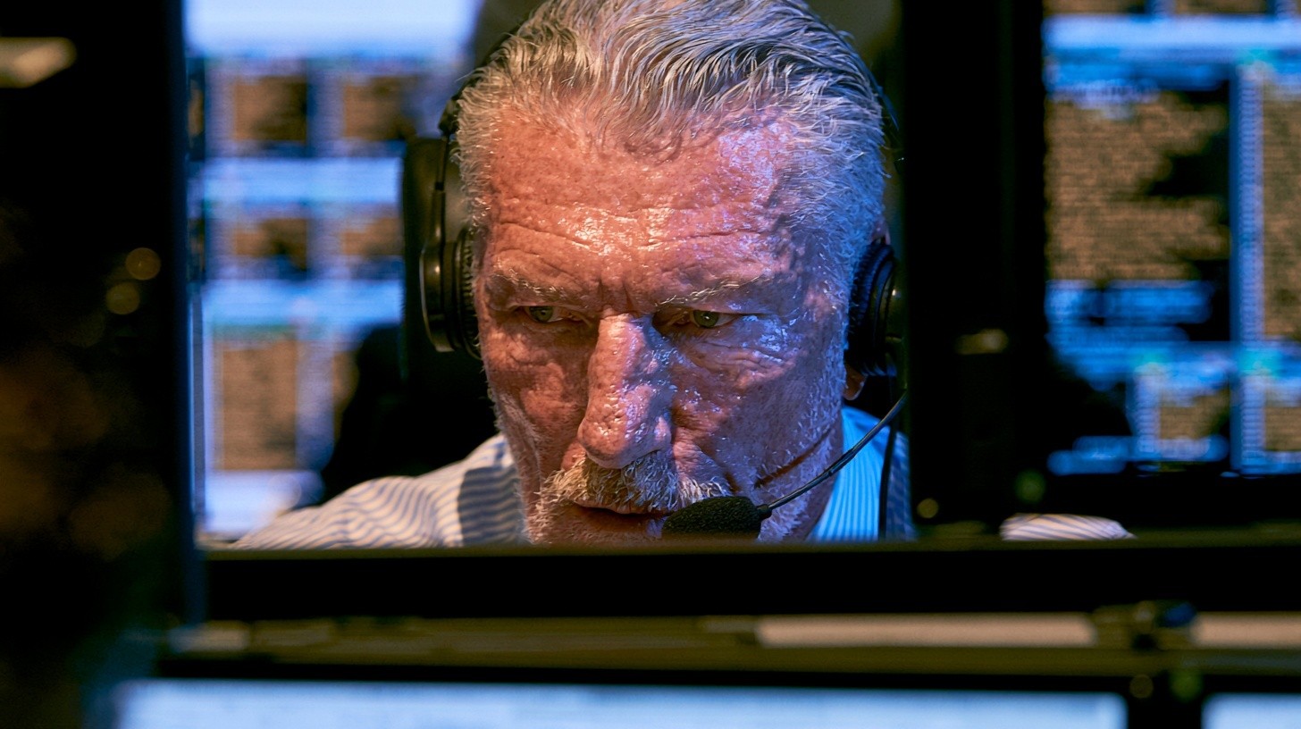 A senior bank compliance buyer tests a voice-AI platform during a vendor demonstration, listening through a headset and validating its controls against a structured checklist