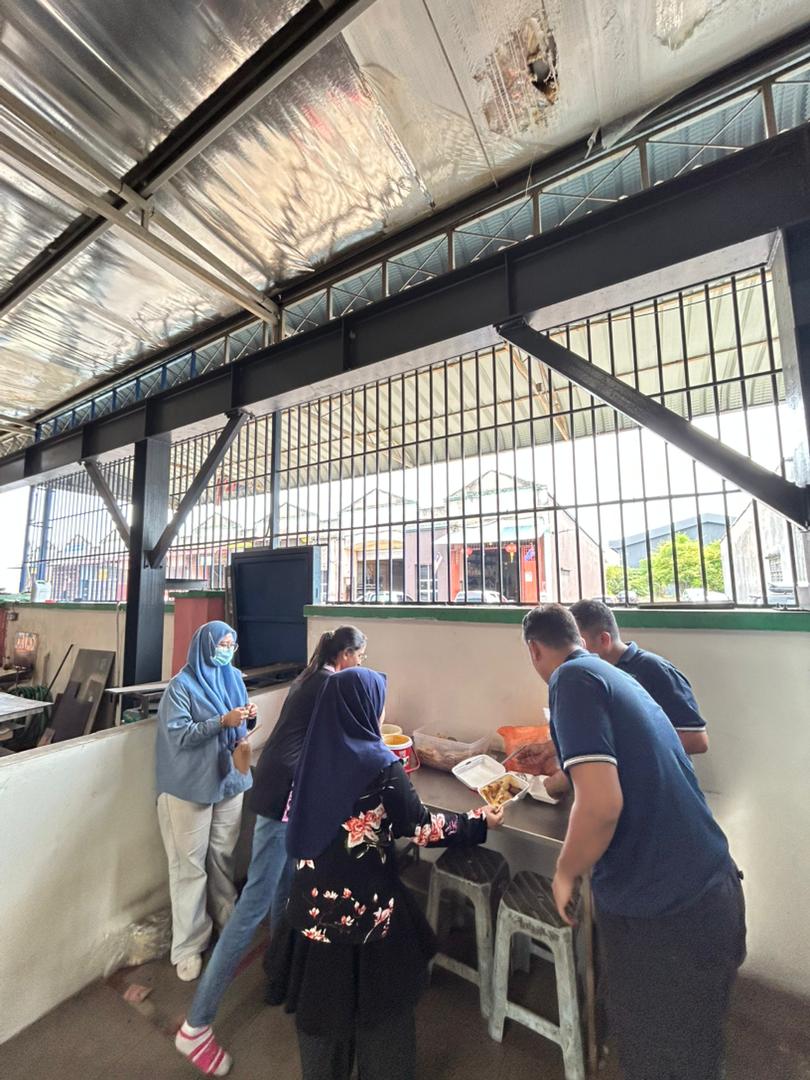 Autofill staff preparing the tea break food in the factory common area, showcasing teamwork.