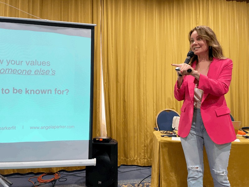 Angela Parker giving a talk during a conference.