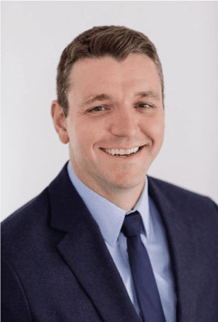 person sitting in a chair in front of a man