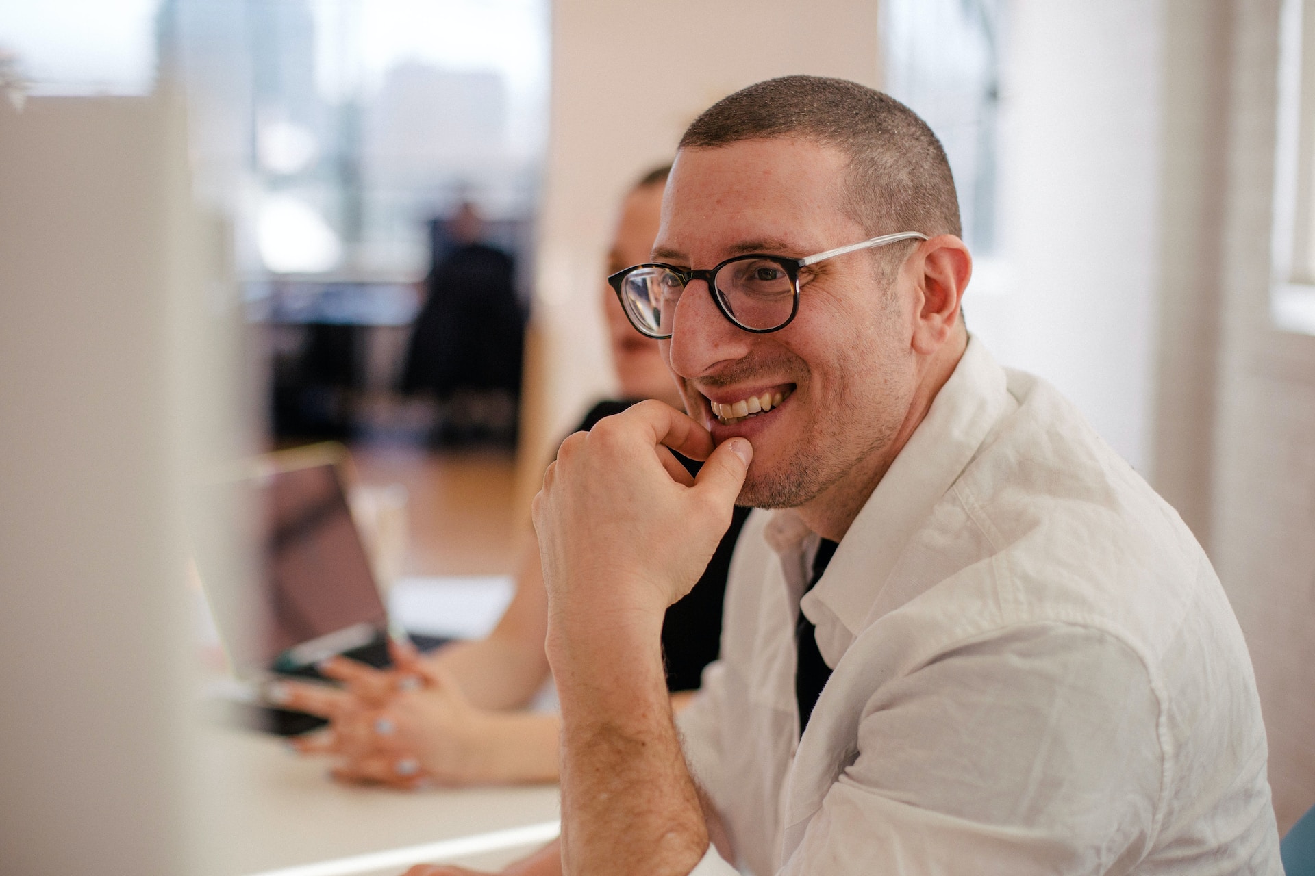 Close-up photograph of man wearing glasses