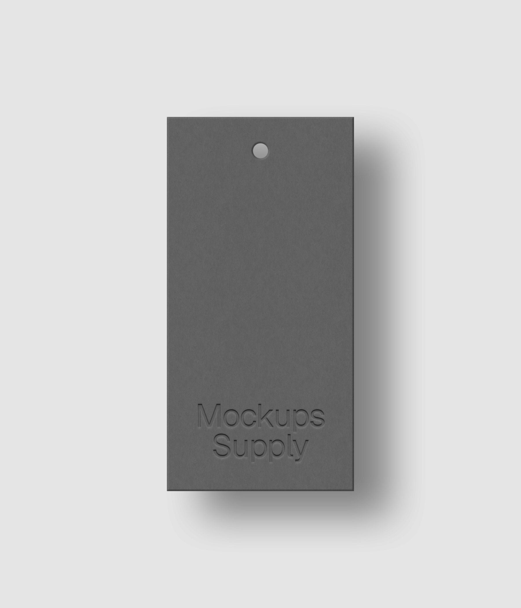 Gray 1x2 hang tag mockup on white background with debossed logo effect and natural shadow depth for Photoshop download psd