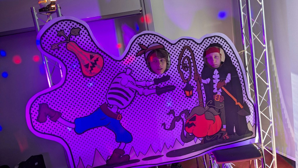 Jasper and Josef posing with the Bonehearts photo wall