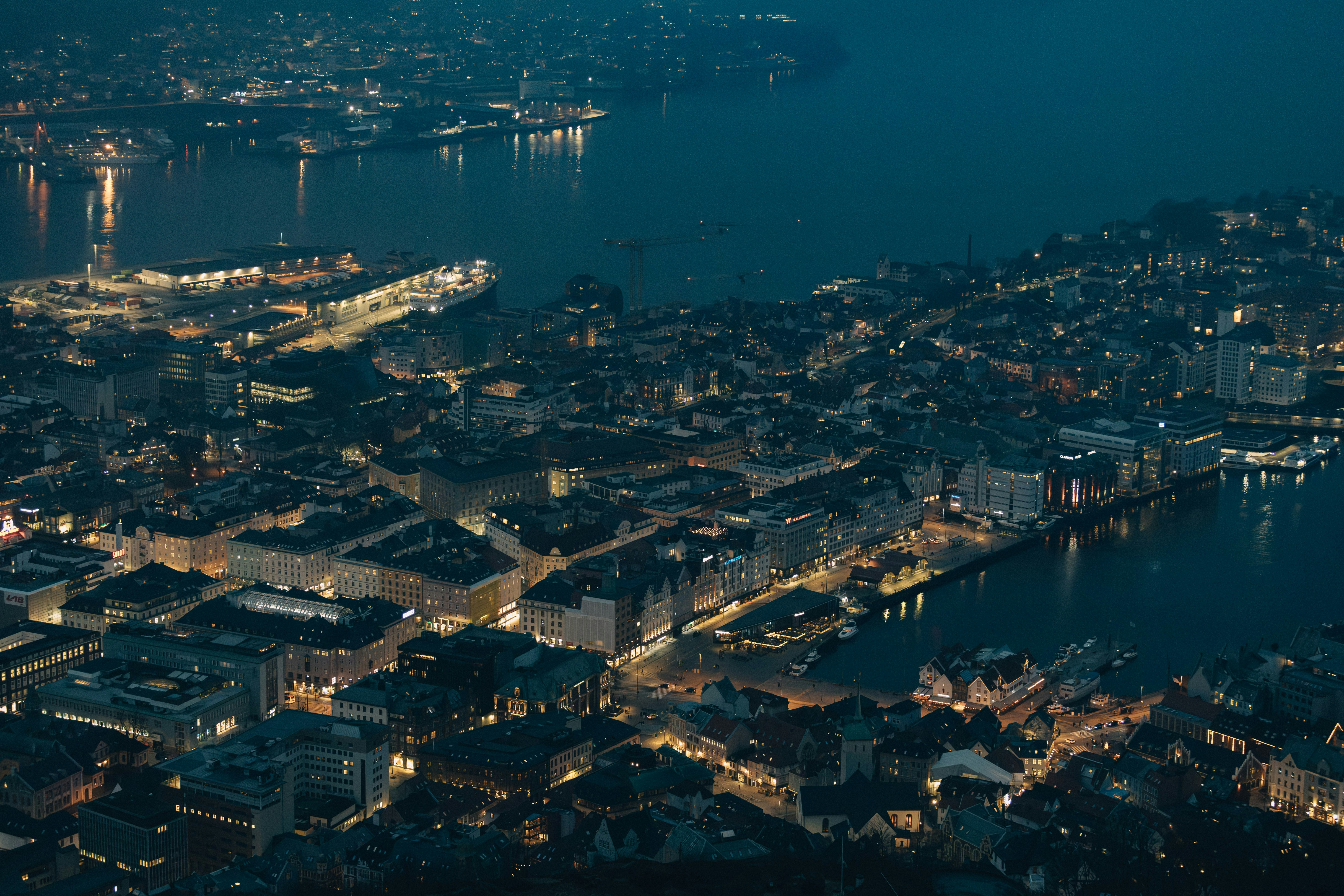 City lights sparkle along the waterfront at night