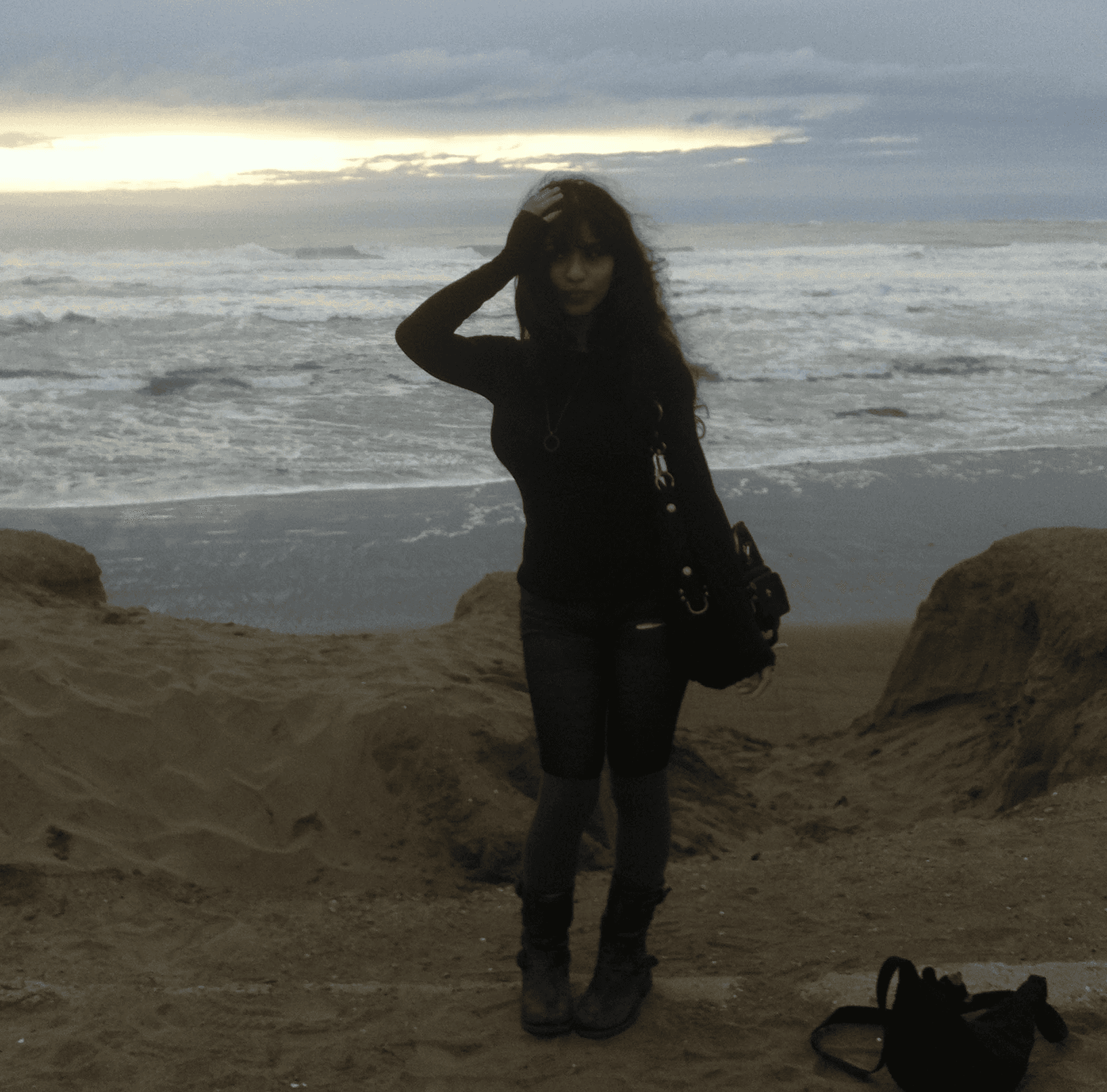 a japanese style building with a japanese roof and trees around it