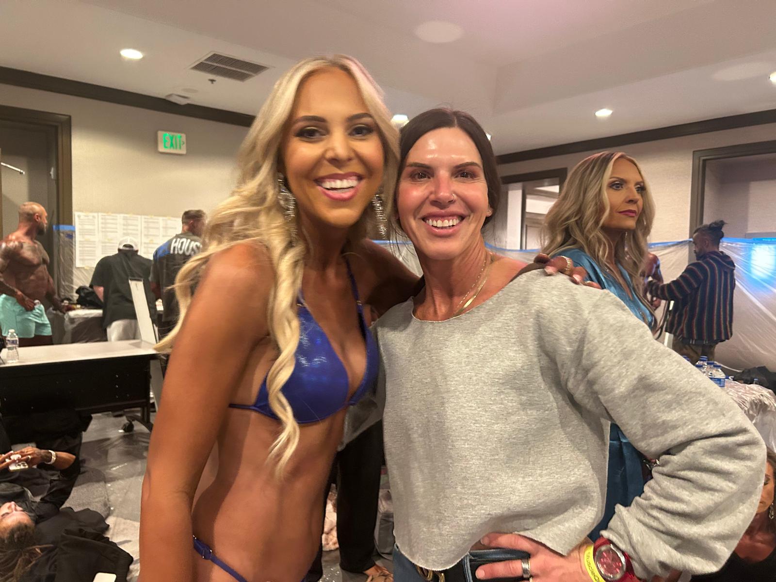 Rachel, personal trainer, looking to the side confidently in a fitness studio