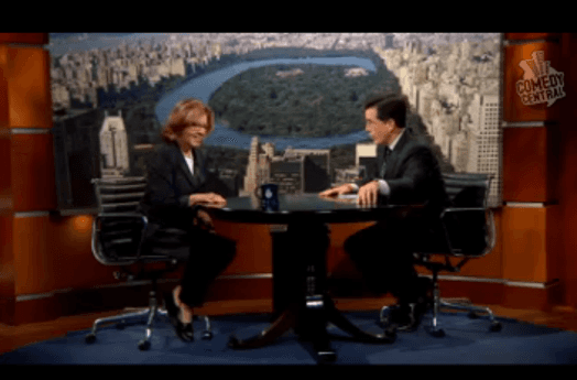 A photo of a man and a woman sitting in a tv studio.
